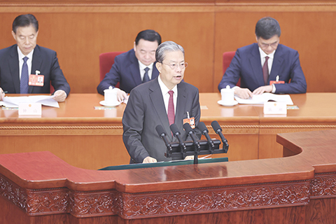 ◎ 三月八日,十四屆全國人大三次會議在北京人民大會堂舉行第二次全體會議。受全國人大常委會委託,趙樂際委員長向大會報告全國人大常委會工作。(中新社記者蔣啟明 攝)